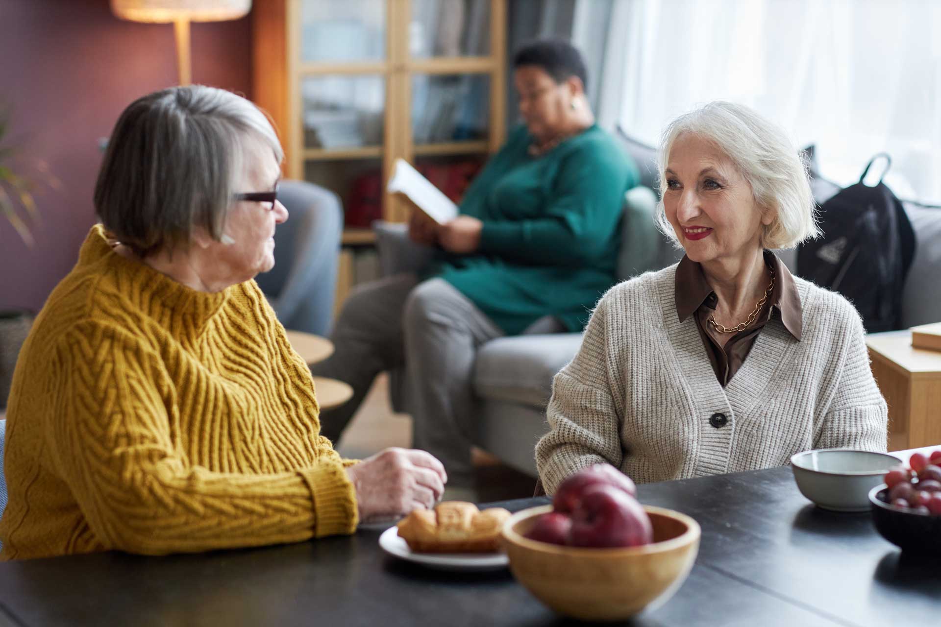 two women talking over breakfast